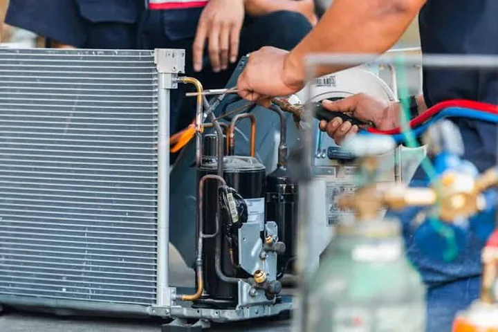 Air conditioning components being prepared for installation and service